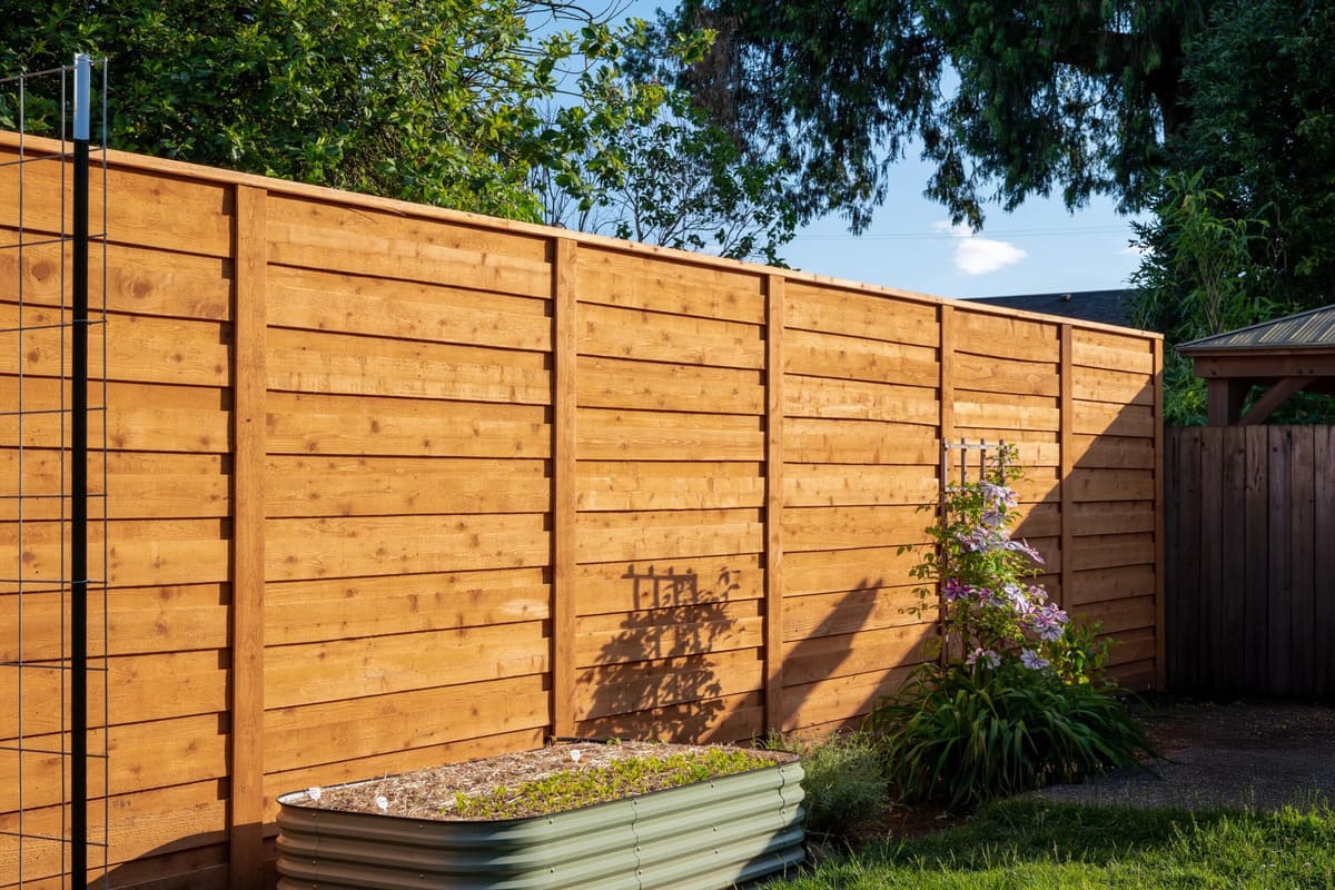 Modern backyard fence installation